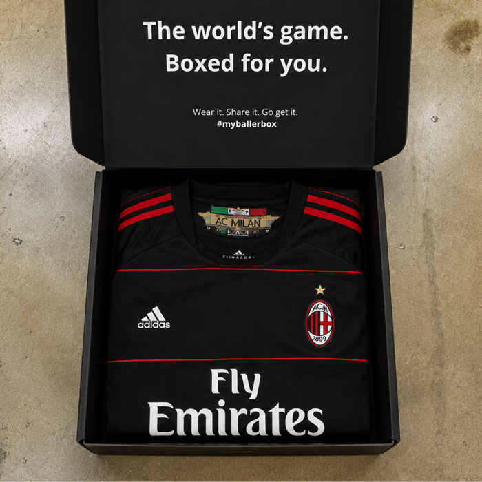 An AC Milan shirt folded inside an opened BallerBox